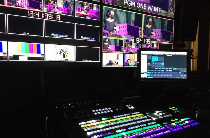 Colorful studio production screens and sound board