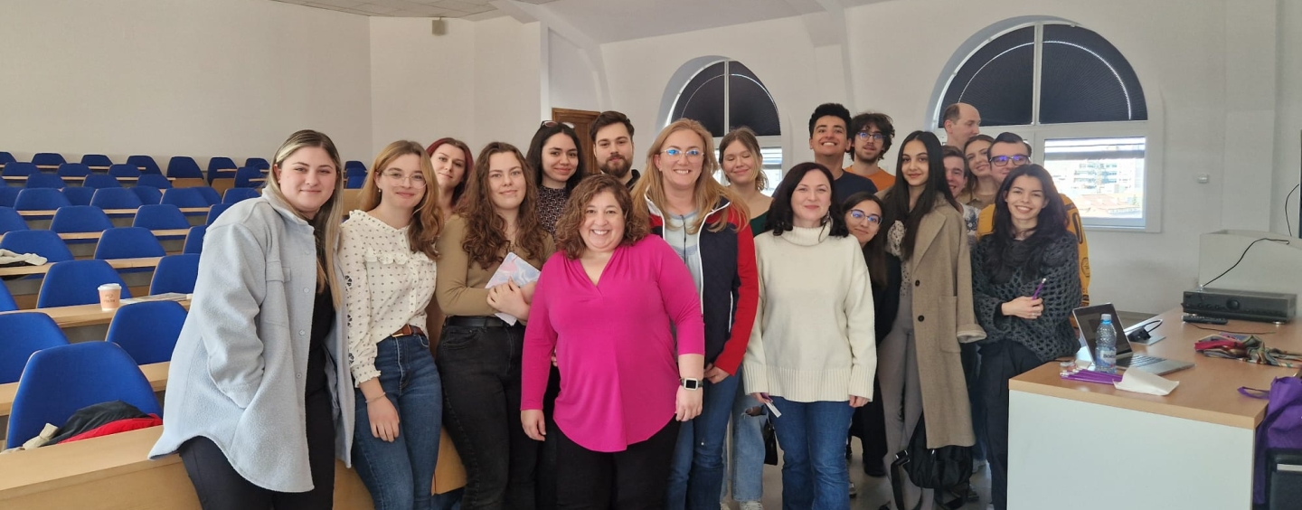 Dr. Melissa Camacho poses with students in Romania